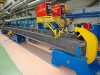 Stand for automatic welding of a center sill with I-beam