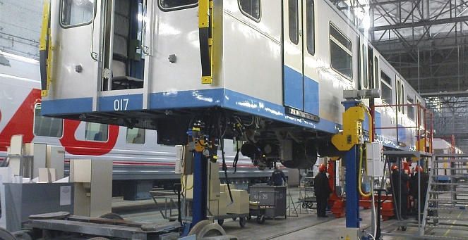 Placement of a metro car on bogies