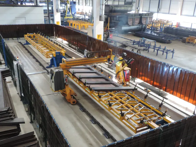 Robotic center for dumper side boards assembly and welding