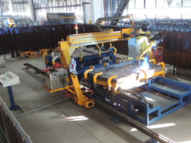 Robotic center for assembly and welding of a dump truck back door