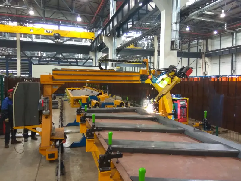 Robotic center for dumper side boards assembly and welding