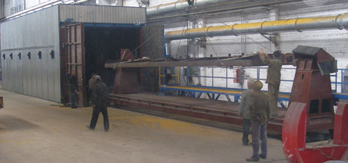 Shot blasting chamber for cleaning wagon frames
