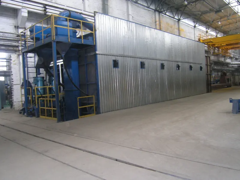 Shot blasting chamber for cleaning wagon frames