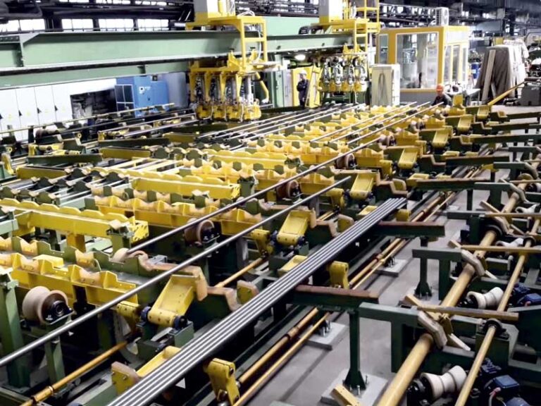 Integrated automated line for weighing, length measuring, stamping and marking of pipes