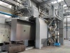 Shot blasting chamber for blast cleaning of welded metalwares