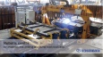 Robotic center for assembly and welding of a dump truck back door